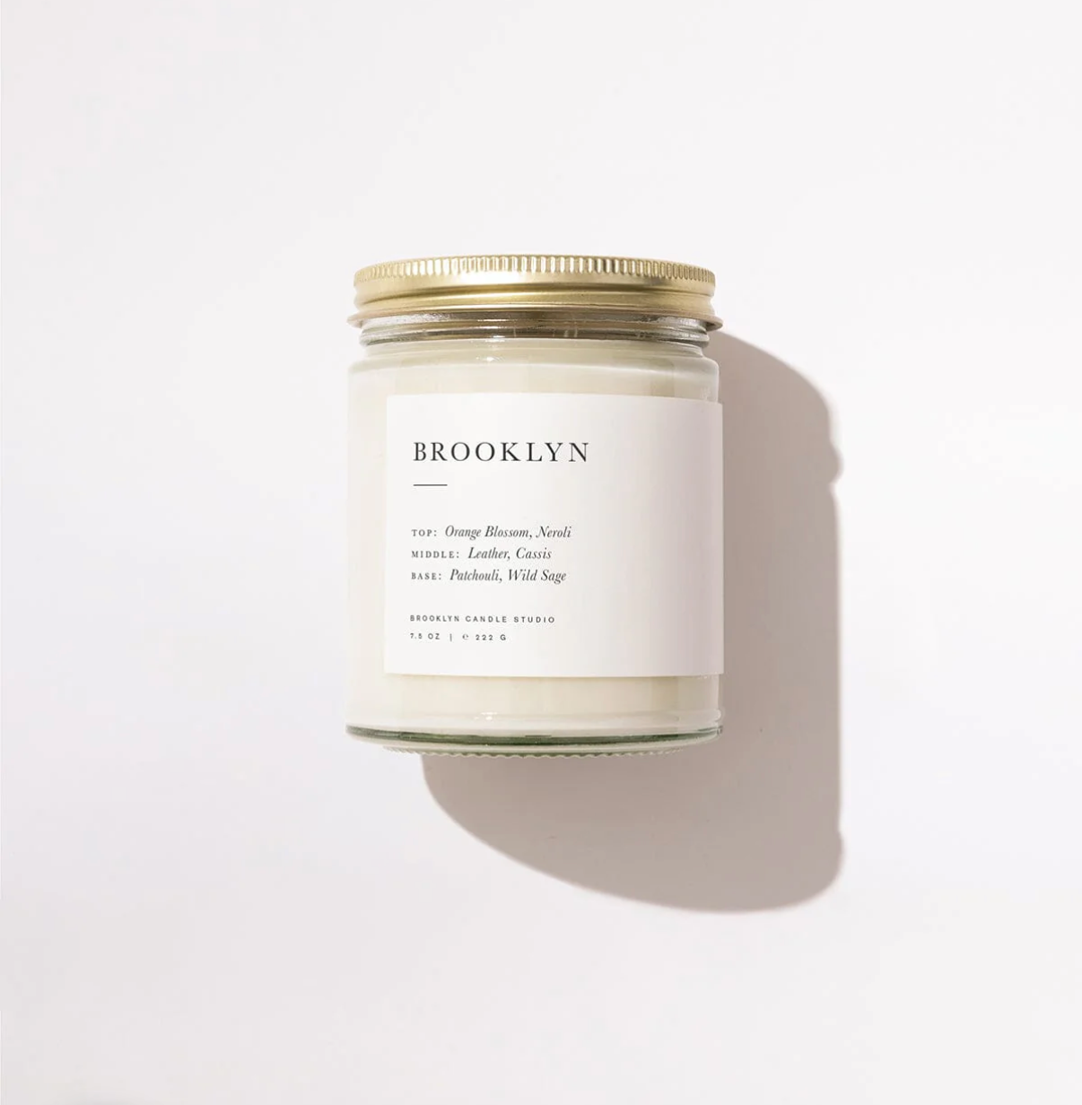 Candle jar labeled 'Brooklyn' on a white background