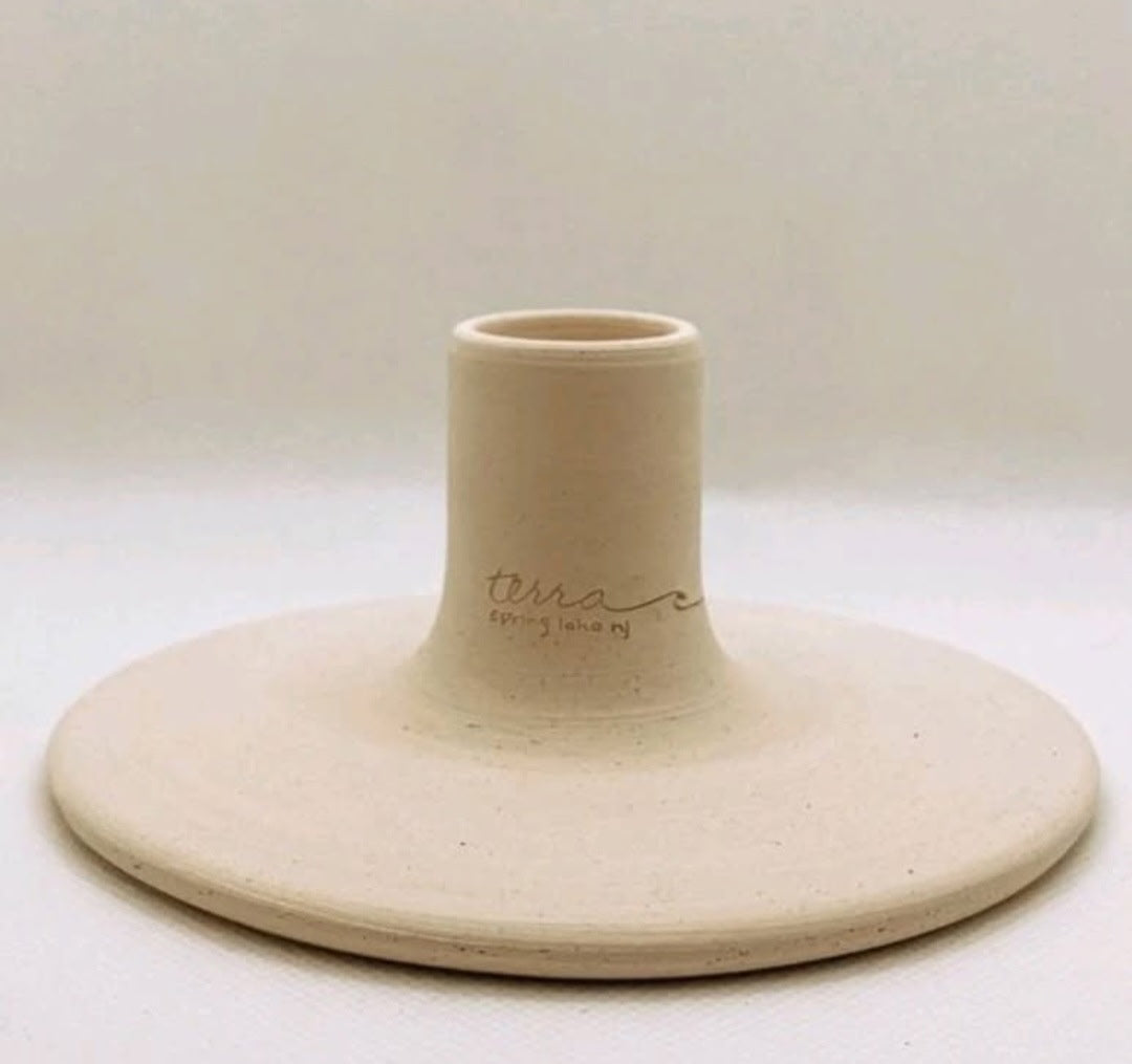 Ceramic flower pot stand with 'Terra' branding on a white background