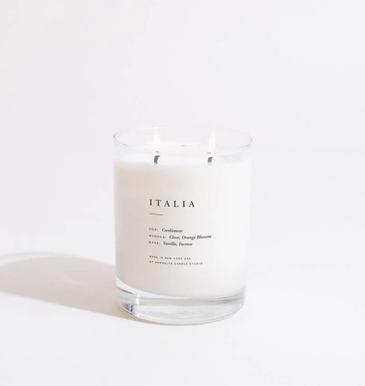 Glass candle labeled 'ITALIA' on a white background