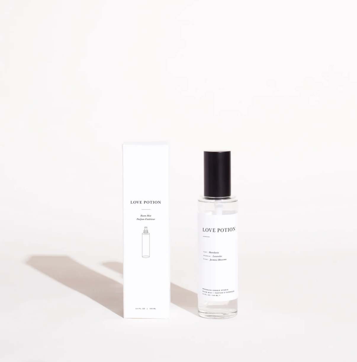 Perfume bottle labeled 'Love Potion' with packaging on a white background