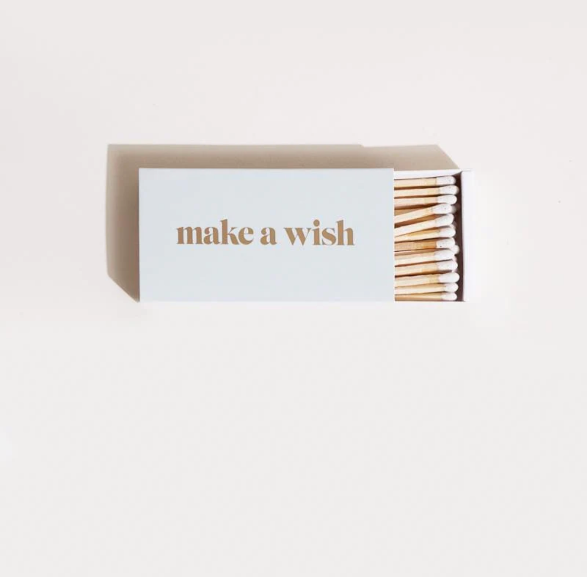 Matches with 'make a wish' text on a white background