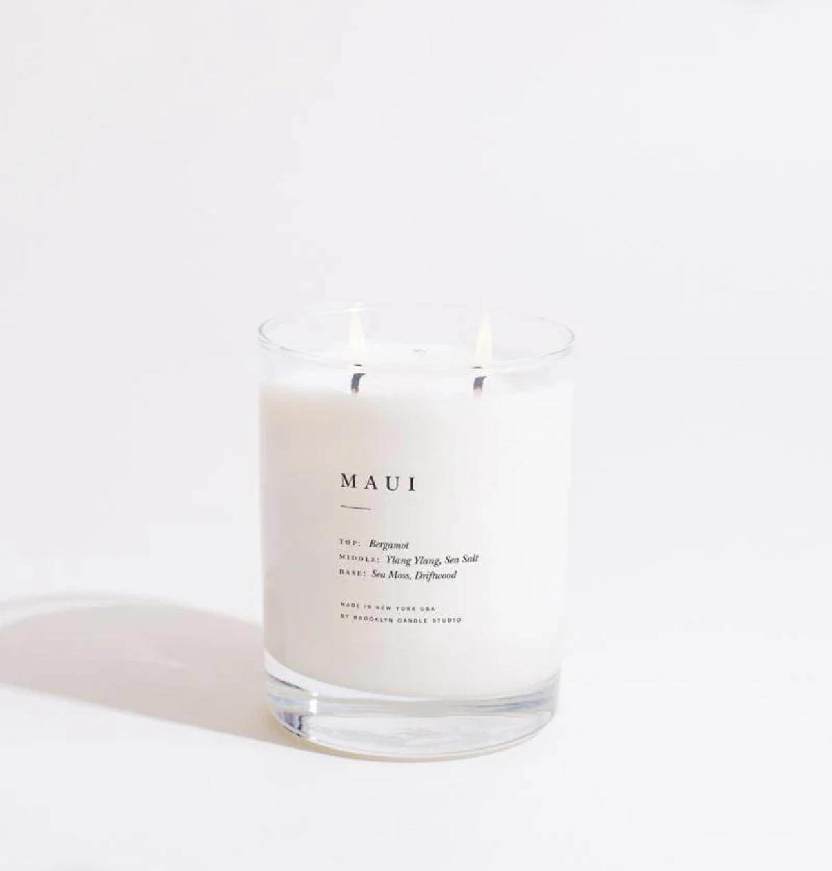Candle labeled 'MAUI' on a white background