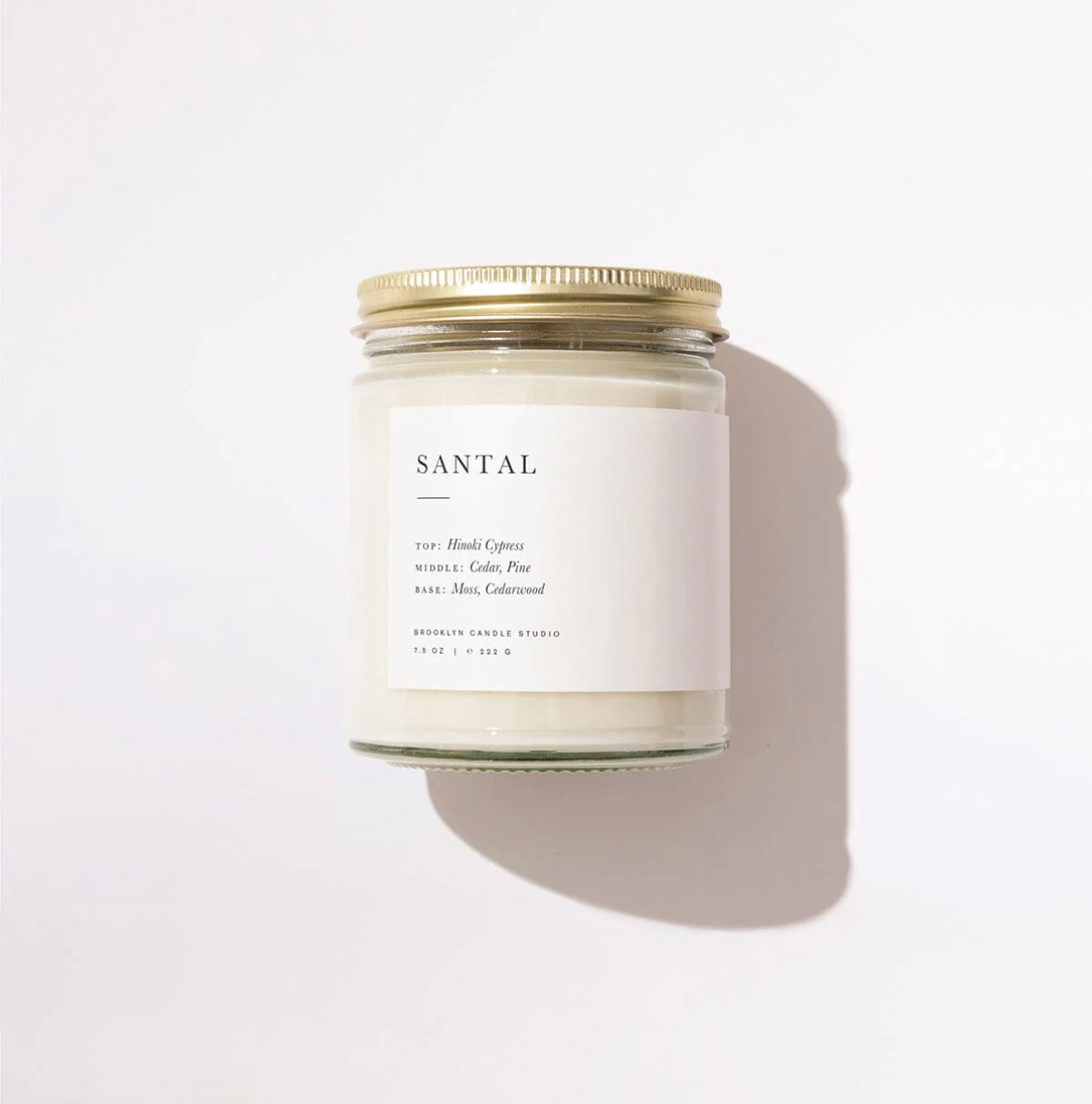 Candle jar labeled 'Santal' on a white background